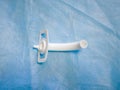 Tracheostomy tube close-up. For emergency care, help close-up. View from above. operation and medicine. Surgeon's tool. scissors