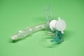 Tracheostomy tube on a green background