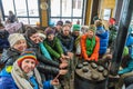 Tourists bask at the stove in the base camp`s cabins at the Thor