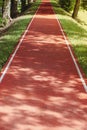 Track and Field Park. Healthy sport. Jogging track at beautiful park. Royalty Free Stock Photo