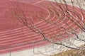 Track at a high school athletic field through the trees Royalty Free Stock Photo