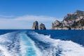 The track from the high-speed ship against the background of individual rocks in the sea- natural and travel background. Royalty Free Stock Photo