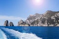 The track from the high-speed ship against the background of individual rocks in the sea- natural and travel background.