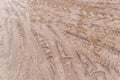 Track pattern trail from vehicle on dirty sandy road soil from wheel texture background Royalty Free Stock Photo