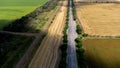 Track and railway running through wheat fields and sunflower fields aerial photography Royalty Free Stock Photo
