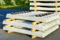 Before track repair stacked new white reinforced concrete railroad track sleepers with rail mounts Royalty Free Stock Photo