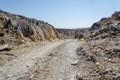 Track running through rocky arid desert scenery in ancient Namib Desert of Angola