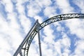 track to green roller coaster with clouds in the sky Royalty Free Stock Photo