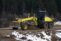 Track-type bulldozer machine doing earthmoving work at sand quarry