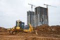 Track-type dozer for pool excavation and utility trenching. Bulldozer during land clearing and foundation digging. Earth-moving Royalty Free Stock Photo