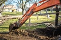 Track-type loader excavator machinery doing earthmoving and leveling at earth quarry Royalty Free Stock Photo