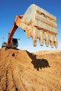 Track-type loader excavator at work