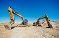 Track-type loader excavators at work