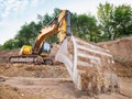 Track type loader is mining stones in opencast mining quarry