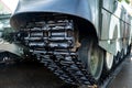 Tracked armor close-up. Black tracks and large rubberized rollers. Tank chassis Royalty Free Stock Photo