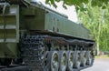 Tracked artillery howitzer stands on the alley in the Park