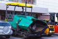 tracked asphalt paving machine. workers went home and threw shovels into paver Royalty Free Stock Photo