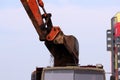tracked excavator bucket digging peat for the preparation of land construction roads and loading it into a truck on site