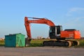 Tracked excavator Hitachi ZAXIS 240LC working at a construction site