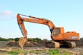 Tracked excavator KRANEKS working at a construction site. During laying or replacement of underground