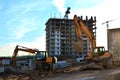 Tracked excavator with raised bucket. Royalty Free Stock Photo