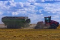 Tractor hauling loaded grain cart