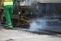 Tracked paver at asphalt pavement works