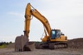 Trackhoe excavator on construction site digger machine heavy equipment Royalty Free Stock Photo