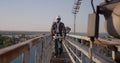 Engineer walking on a cellular tower