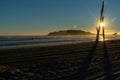 Tracks from beach grooming leading away towards sunrise Royalty Free Stock Photo