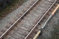 Tracks for metro trains on gravel with contact rail, diagonal top view Royalty Free Stock Photo