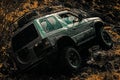 Tracks on a muddy field. Bottom view to big offroad car wheel on country road and mountains backdrop. Off-road vehicle Royalty Free Stock Photo