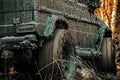 Tracks on a muddy field. Expedition offroader. Bottom view to big offroad car wheel on country road and mountains Royalty Free Stock Photo