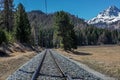 Tracks of the Raetian Railways leading to the mountains - 1 Royalty Free Stock Photo