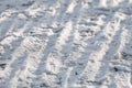 Tracks from the tread of bicycle tires on the snow Royalty Free Stock Photo