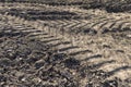 tracks from the tread of trucks and tractors on the field Royalty Free Stock Photo