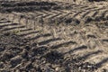 tracks from the tread of trucks and tractors on the field Royalty Free Stock Photo