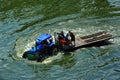 Tracter drove on flood in Bangkok Royalty Free Stock Photo