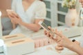 Tractive  girl take selfie with a phone at the mirror with lamps in the beauty studio Royalty Free Stock Photo