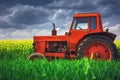 Tractor in the agricultural fields Royalty Free Stock Photo