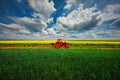 Tractor in the agricultural fields Royalty Free Stock Photo