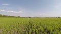 Tractor applying herbicide