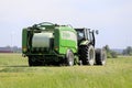 Tractor and Baler Baling Silage on Sunny Day Royalty Free Stock Photo