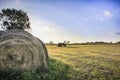 Tractor baling hay in a Nebraska field. Royalty Free Stock Photo