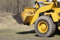 Tractor with bucket.The bulldozer is carrying out repair work.Construction works