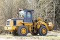 Tractor with bucket.The bulldozer is carrying out repair work.Construction works