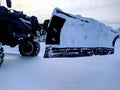 tractor with a bucket for cleaning snow in the daytime in winter. Royalty Free Stock Photo