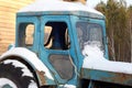 Tractor cab in the yard of a rural house, close-up. Agriculture is a household in a mountainous area Royalty Free Stock Photo