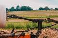Tractor and cardan shaft for coupling equipment, tractor in the field during haymaking Royalty Free Stock Photo