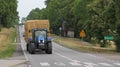 The tractor carries straw, tansport of straw Royalty Free Stock Photo